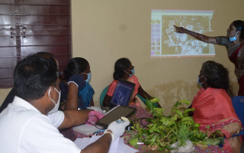 Women farmers learning at a plant clinic, India