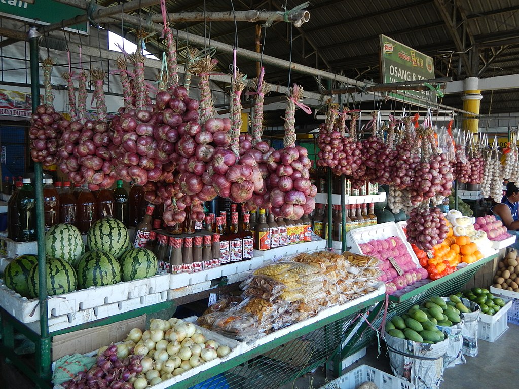 red onions for sale at a market stand in the Philippines