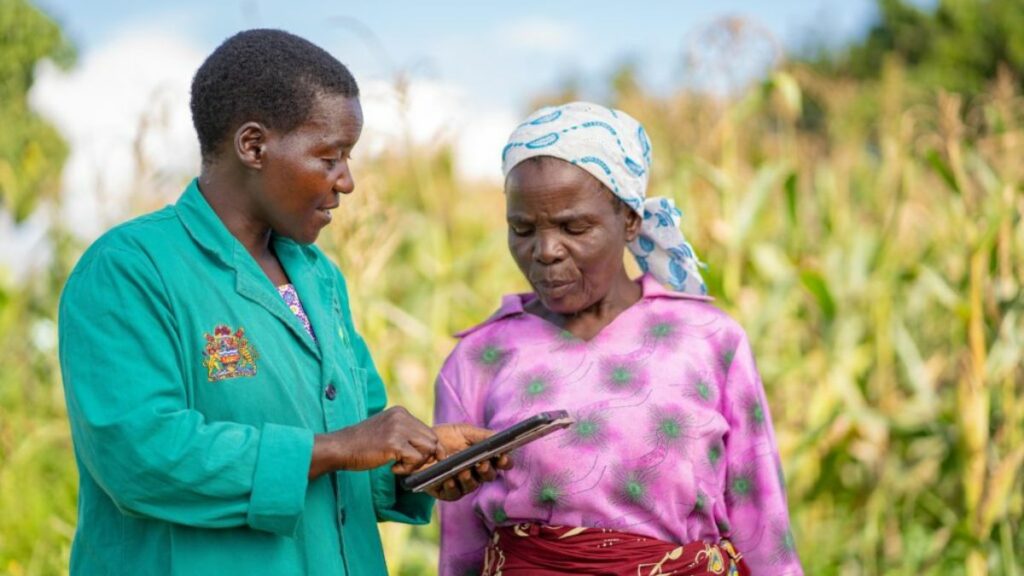 Extension worker using a tablet in the field