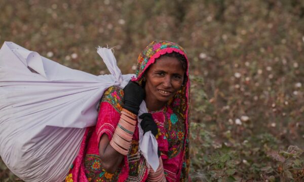 Amarti carries raw cotton bags after picking at the Farm Naimatullah Laghari, Sinjhoro, Sanghar, Sindh, Pakistan.