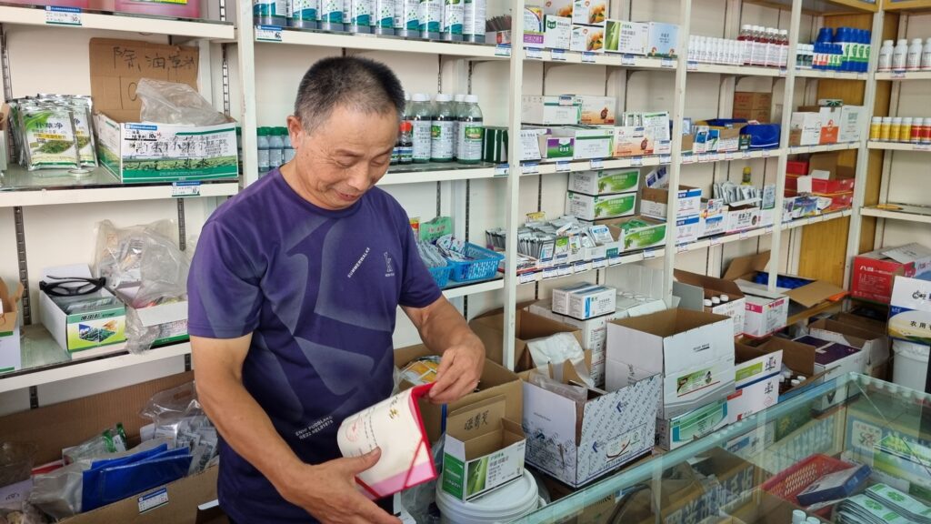 A shop owner Shizhong district, Leshan prefecture, Sichuan province, China pictured.