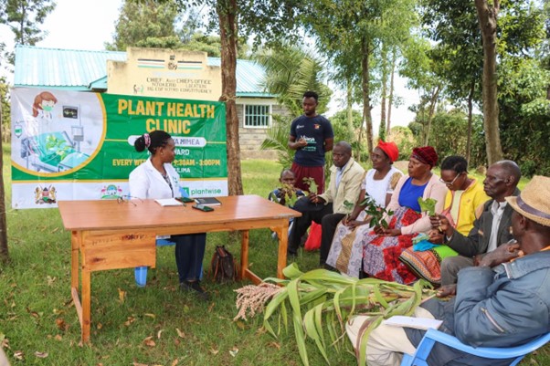 Florence Malemba with farmers at a plant clinic held on 6th November 2024 at the Njokerio Chiefs camp in Njoro, Nakuru county.
