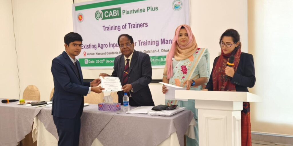 Agro-input dealer receiving his course certificate.